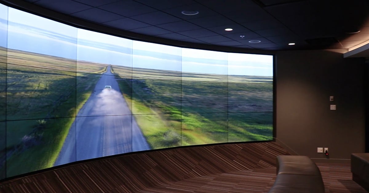 Curved Userful powered video wall in an immersive theatre in the Calgary Tower, displaying a movie