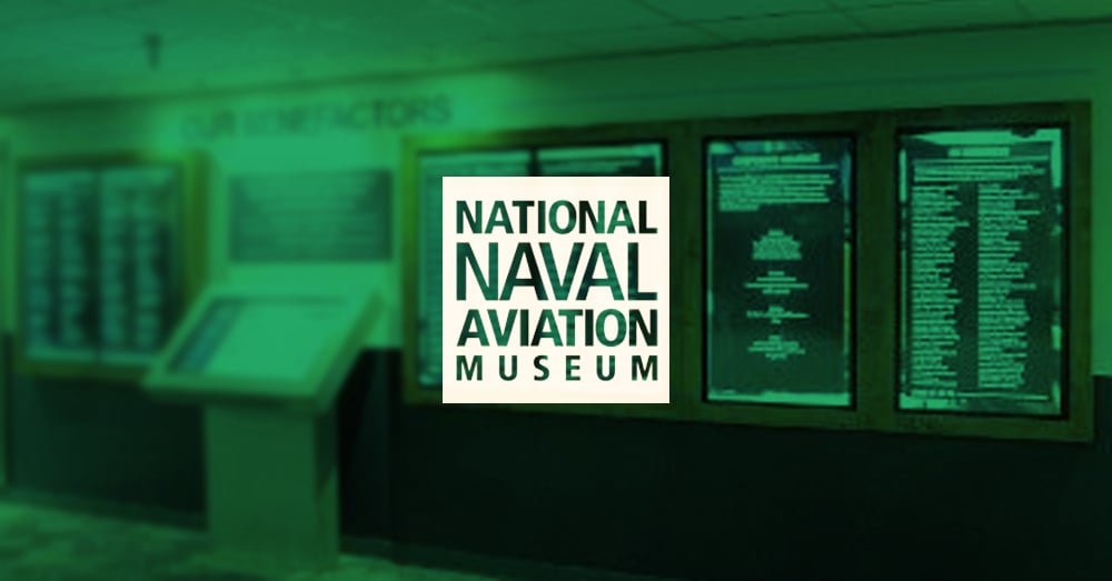 National Naval Aviation Museum empty Hall of Recognition, with video walls for donor recognition display with green overlay and logo