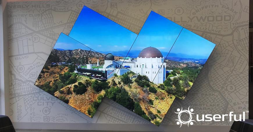 Künstlerische Mosaik-Videowand mit einem Foto des Griffith-Observatoriums, weißes Userful-Logo in der rechten unteren Ecke